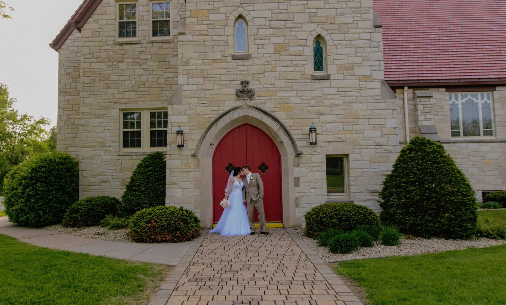 church exterior with wedding couple